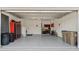 Spacious garage with storage cabinets and epoxy flooring at 2071 Limestone Trl, Kissimmee, FL 34747
