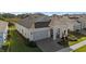 One-story house featuring a gray exterior, gray roof, and covered front porch at 2071 Limestone Trl, Kissimmee, FL 34747