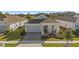 Single-story home with gray exterior, gray roof, and a covered front porch at 2071 Limestone Trl, Kissimmee, FL 34747