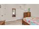 Serene bedroom featuring a full-length mirror and closet at 2071 Limestone Trl, Kissimmee, FL 34747