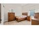 Charming bedroom with wood furniture and quilt bedding at 2071 Limestone Trl, Kissimmee, FL 34747