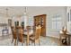 Bright dining room featuring a wood table and chairs, and a built-in hutch at 2071 Limestone Trl, Kissimmee, FL 34747