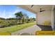 Covered patio overlooking a tranquil backyard landscape at 2071 Limestone Trl, Kissimmee, FL 34747