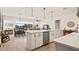 Open concept kitchen with large island, stainless steel appliances, and view to dining area at 2071 Limestone Trl, Kissimmee, FL 34747