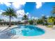 Inviting kidney-shaped pool surrounded by lounge chairs at 2071 Limestone Trl, Kissimmee, FL 34747