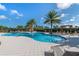Resort-style pool with plenty of lounge chairs for sunbathing at 2071 Limestone Trl, Kissimmee, FL 34747