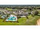 Aerial view of community pool, tennis courts, and clubhouse at 2071 Limestone Trl, Kissimmee, FL 34747
