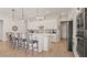 Modern kitchen with white shaker cabinets, quartz countertops, and stainless steel appliances at 2071 Limestone Trl, Kissimmee, FL 34747