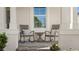 Relaxing covered porch with rocking chairs and small table at 2071 Limestone Trl, Kissimmee, FL 34747