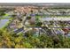 Aerial view of houses near a lake and conservation area at 1055 Lake Berkley Dr, Kissimmee, FL 34746
