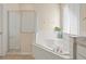 Spa-like bathroom featuring a corner soaking tub and a walk-in shower at 1055 Lake Berkley Dr, Kissimmee, FL 34746