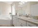 Elegant bathroom with soaking tub, separate shower, and updated vanity at 1055 Lake Berkley Dr, Kissimmee, FL 34746