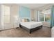 Comfortable main bedroom with a large bed and ensuite bathroom at 1055 Lake Berkley Dr, Kissimmee, FL 34746