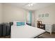 Bedroom with a sleeper sofa, desk and chair, and window at 1055 Lake Berkley Dr, Kissimmee, FL 34746
