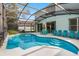 Inviting screened pool and spa with ample seating at 1055 Lake Berkley Dr, Kissimmee, FL 34746