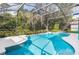 Refreshing screened pool perfect for summer days at 1055 Lake Berkley Dr, Kissimmee, FL 34746