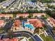 Community pool with surrounding townhouses at 1055 Lake Berkley Dr, Kissimmee, FL 34746