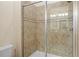 Clean shower with glass enclosure and neutral tile at 1473 Moon Valley Dr, Davenport, FL 33896