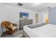 Main bedroom with dresser and wicker chair at 1473 Moon Valley Dr, Davenport, FL 33896