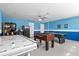 Game room with foosball, air hockey, and a mini-fridge at 1473 Moon Valley Dr, Davenport, FL 33896