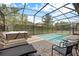 Relaxing pool and spa area with plenty of lounge chairs at 1473 Moon Valley Dr, Davenport, FL 33896