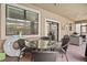 Outdoor dining area on a covered patio with seating for four at 1473 Moon Valley Dr, Davenport, FL 33896