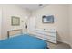 Comfortable bedroom with a double bed, dresser, and wall-mounted TV at 1473 Moon Valley Dr, Davenport, FL 33896