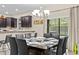 Bright dining room with a large table, seating for eight, and access to the patio at 1473 Moon Valley Dr, Davenport, FL 33896