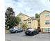 Building exterior with parking lot and landscaping at 413 Summit Ridge Pl # 209, Longwood, FL 32779