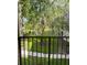 Balcony view overlooking a tranquil pond and lush green landscaping at 413 Summit Ridge Pl # 209, Longwood, FL 32779