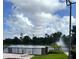 Scenic lake view with fountain and lush landscaping at 413 Summit Ridge Pl # 209, Longwood, FL 32779