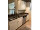 Kitchen with granite countertops, double sink, and white cabinets at 413 Summit Ridge Pl # 209, Longwood, FL 32779