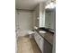 Clean bathroom with granite countertops and a bathtub at 413 Summit Ridge Pl # 209, Longwood, FL 32779