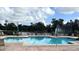 Community pool with lake view and fountain at 413 Summit Ridge Pl # 209, Longwood, FL 32779