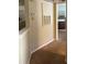 Simple hallway with neutral colored carpet and walls at 413 Summit Ridge Pl # 209, Longwood, FL 32779