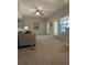 Bright living room with neutral carpeting and access to a patio at 413 Summit Ridge Pl # 209, Longwood, FL 32779
