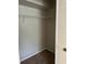 Large closet with wire shelving, providing convenient storage at 413 Summit Ridge Pl # 209, Longwood, FL 32779