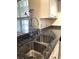 Modern double sink with a high-arc faucet in the kitchen at 413 Summit Ridge Pl # 209, Longwood, FL 32779