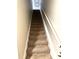 Carpeted staircase leading to the upper level of the condo at 413 Summit Ridge Pl # 209, Longwood, FL 32779