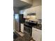 Modern kitchen featuring stainless steel appliances and granite countertops at 413 Summit Ridge Pl # 209, Longwood, FL 32779