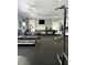 Fitness center with various equipment and a TV at 413 Summit Ridge Pl # 209, Longwood, FL 32779