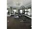 Well-equipped fitness center with cardio and strength training machines at 413 Summit Ridge Pl # 209, Longwood, FL 32779