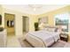 Well-lit bedroom with a queen bed and walk-in closet at 514 Margaret Ln, Lake Wales, FL 33853
