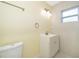 Updated bathroom with pedestal sink, toilet and tile at 514 Margaret Ln, Lake Wales, FL 33853