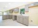 Modern kitchen with gray cabinets, white countertops, and an island at 514 Margaret Ln, Lake Wales, FL 33853