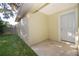 Small patio adjacent to the house with backyard access at 514 Margaret Ln, Lake Wales, FL 33853