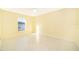 Bright bedroom featuring light walls and tile flooring at 514 Margaret Ln, Lake Wales, FL 33853