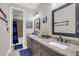 Bathroom with a nautical theme, double vanity and granite countertop at 4001 Ainsley Ave, Orlando, FL 32833