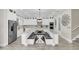 Spacious kitchen with white cabinets, large island, and stainless steel appliances at 4001 Ainsley Ave, Orlando, FL 32833
