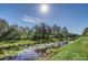 Serene canal view with lush vegetation at 4001 Ainsley Ave, Orlando, FL 32833